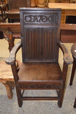 Lot 244 - An ecclesiastical style oak armchair...