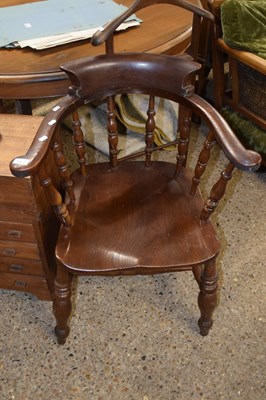 Lot 271 - An elm seated captains chair with spindle...