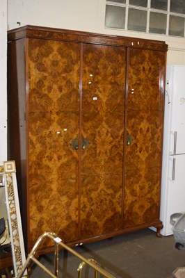 Lot 668 - An Edwardian walnut veneered triple door wardrobe