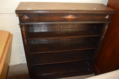 Lot 695 - An early 20th Century oak open front bookcase...