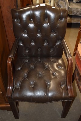 Lot 699 - A leather finish desk chair