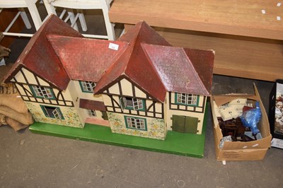 Lot 723 - A vintage dolls house and accompanying furniture