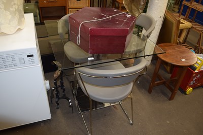 Lot 746 - A glass topped kitchen table and three chairs