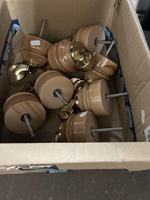 Lot 628 - Box of various wooden casters for furniture etc