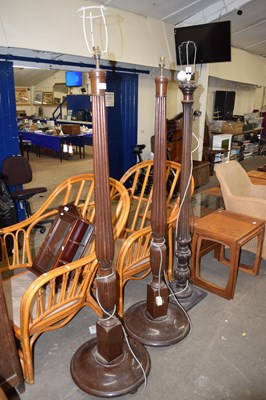 Lot 784 - A pair of mahogany standard lamps with fluted...