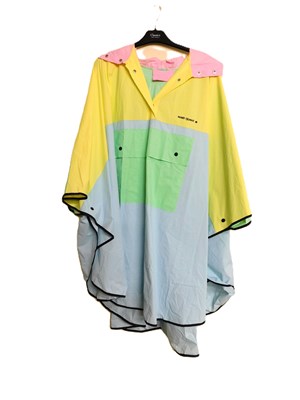 Lot 61 - A Mary Quant PVC hooded rain poncho, in pastel...