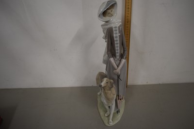 Lot 146 - Large Lladro figure of a lady with a dog