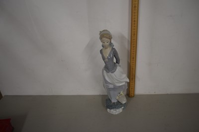 Lot 147 - Large Lladro figure of a girl holding a book