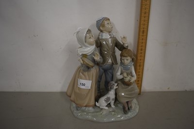 Lot 150 - Lladro figure group of three singing children...