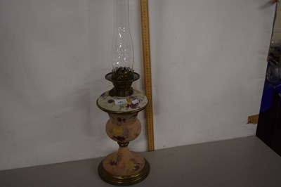 Lot 173 - Early 20th century oil lamp with rust textured...