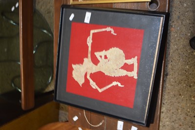 Lot 339 - Two Indonesian cut-outs of shadow puppets, framed