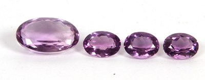 Lot 279 - Four loose oval amethysts: approx. 15.7 x 24 x...