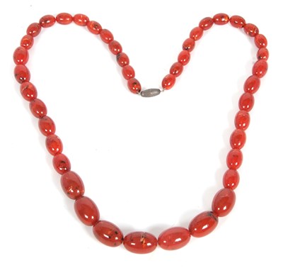 Lot 280 - A faux amber necklace, the graduated beads...