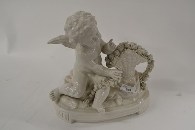 Lot 309 - A continental porcelain model of a cherub by a...