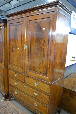 Lot 510 - A Georgian mahogany linen press cabinet with...