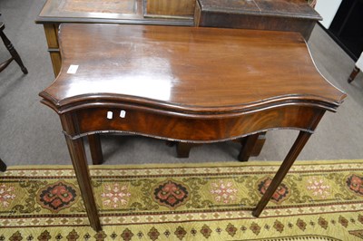 Lot 595 - A Georgian mahogany card table of serpentine...