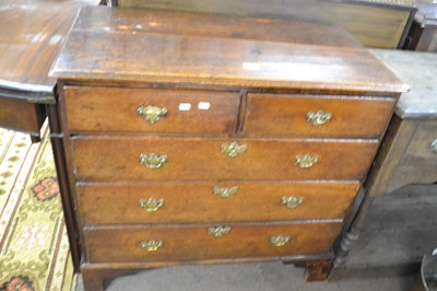 Lot 555 - An 18th Century oak chest of two short over...