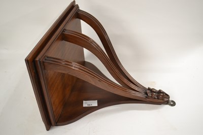 Lot 561 - A mahogany wall bracket with three curved...