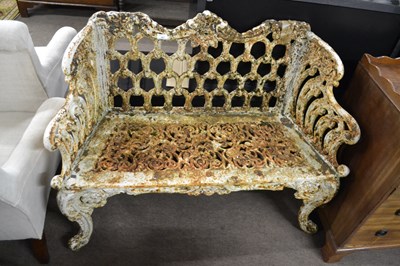 Lot 567 - A small Victorian cast iron garden bench with...