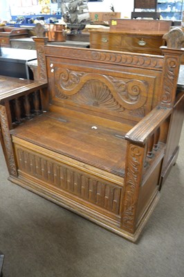 Lot 570 - A late 19th or early 20th Century oak hall...