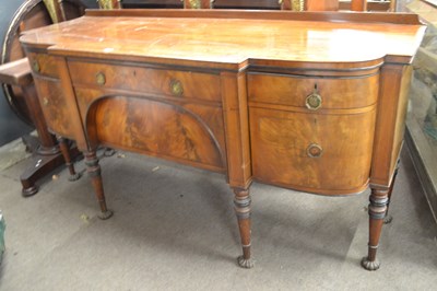 Lot 572 - A large Georgian mahogany sideboard with bow...