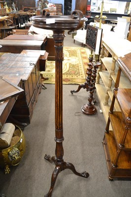 Lot 592 - A 20th Century hardwood torchere  plant stand,...