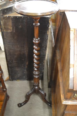 Lot 593 - A 20th Century hardwood torchere plant stand...