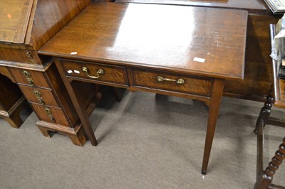 Lot 597 - A George III oak two drawer side table with...