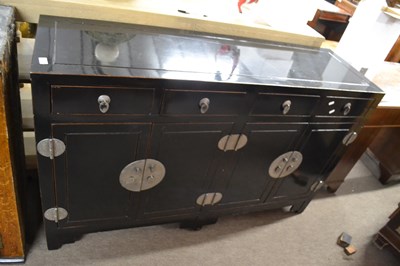 Lot 536 - A 20th Century Chinese black lacquered...