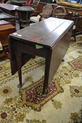 Lot 619 - A Georgian oak drop leaf dining table raised...