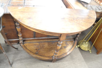 Lot 632 - A 20th Century oak demi lune side table raised...