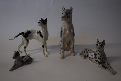 Lot 445 - Group of porcelain models of hounds including...