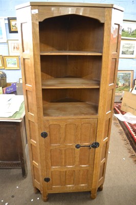 Lot 654 - A 20th Century oak corner cabinet with adzed...