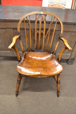 Lot 655 - A contemporary stick back armchair with elm...