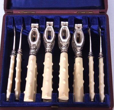 Lot 224 - An unusual cased set of four silver plated and...