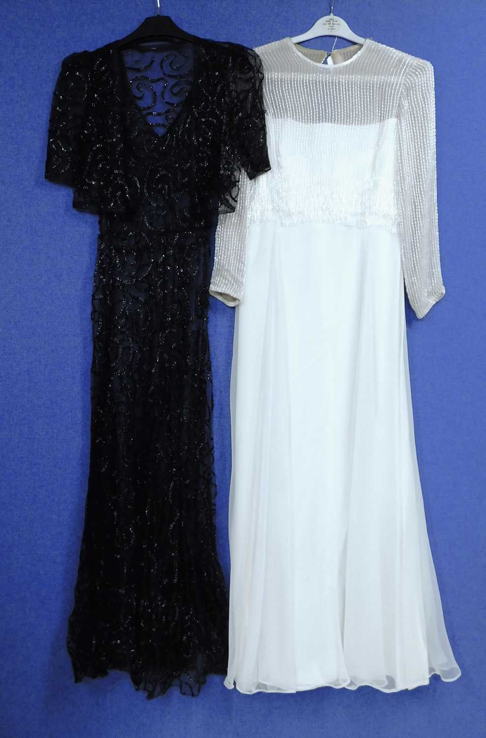 Lot 10 - A lady's black net and ribboned style V neck...