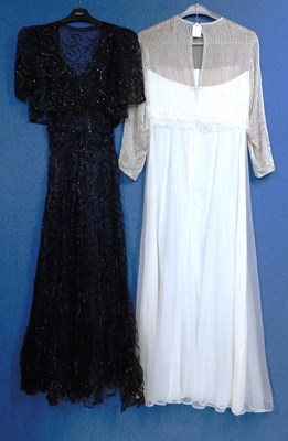 Lot 10 - A lady's black net and ribboned style V neck...