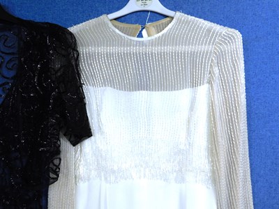 Lot 10 - A lady's black net and ribboned style V neck...