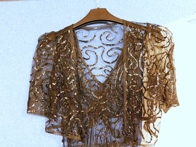 Lot 10 - A lady's black net and ribboned style V neck...