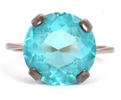 Lot 44 - A blue stone ring, the round faceted blue...