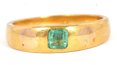 Lot 56 - An emerald ring, set to centre with a...