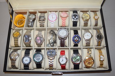 Lot 99 - A display case with various modern wristwatches