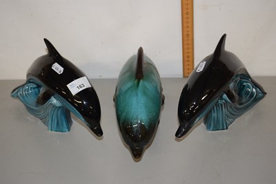 Lot 163 - Two Poole pottery model dolphins and a Glue...