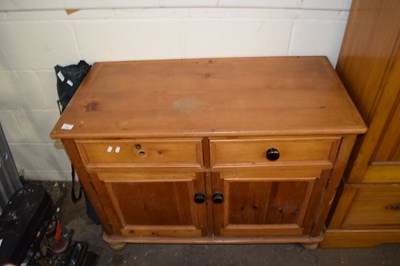 Lot 516 - A pine sideboard of two drawers and cupboards...