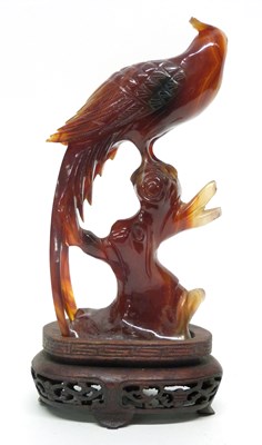 Lot 12 - Amber coloured glass model of a pheasant on...
