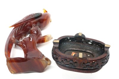 Lot 12 - Amber coloured glass model of a pheasant on...