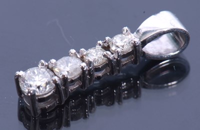 Lot 181 - Modern diamond pendant featuring four...