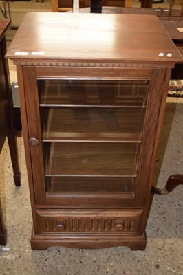 Lot 251 - An Ercol elm hi-fi cabinet with carved decoration