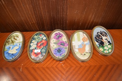 Lot 781 - Set of five oval needlework pictures