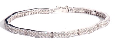 Lot 202 - Modern articulated line bracelet set with...
